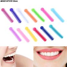 20 unids/lote de palos para ataduras dentales bandas elásticas de goma multicolor para dientes de salud herramienta 6x1,2 cm 2024 - compra barato