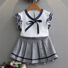 Летние комплекты одежды для девочек Корейская Кружевная футболка с короткими рукавами для колледжа + плиссированная юбка + галстук-бабочка, 2 предмета, Униформа, детская одежда 2024 - купить недорого