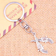 New Fashion Keychain 31*23 mm crossed pistols revolvers western Pendants DIY Men Jewelry Car Key Chain Souvenir For Gift 2024 - buy cheap