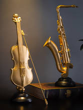 Accesorios de decoración del hogar para sala de estar, estatua de saxofón de violín Retro, adorno de resina, decoración Vintage para el hogar, novedad 2024 - compra barato
