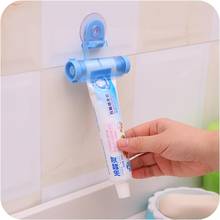 Toothpaste Dispenser Squeezer Creative Rolling Tube Suction Cup Hanging Holder Toothpaste Tube Press Squeezer Bathroom 2024 - compra barato