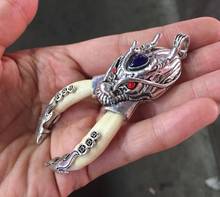 China dentes de lobo tibetano pingente de dragão de prata decorar estátua 2024 - compre barato