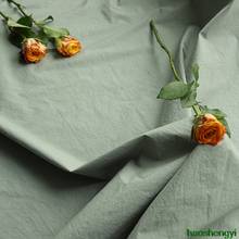 Tecido de vestuário de algodão de alta densidade, textura de papel verde de feijão original 2024 - compre barato