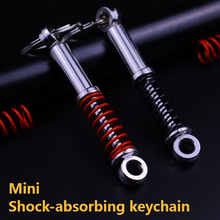 Car mini shock absorber keychain, auto parts, adjustment parts, shock absorber, key chain, spring 2024 - buy cheap