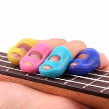 Silicone fingertip protetor fingerstall guitarra corda dedo guarda mão esquerda contra a imprensa dedo dolorida balada guitarra s/m/l 2024 - compre barato