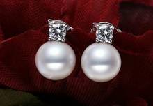 Un par de 10-11mm AAA Mar del Sur perla redonda blanca pendientes colgantes de plata 2024 - compra barato