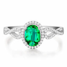 Кольцо женское золотистое/серебристое с зелеными кристаллами и изумрудами 2024 - купить недорого