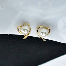 Pendientes de Clip con forma de corazón y Perla simulada para mujer, joyería sin perforaciones, Color dorado 2024 - compra barato