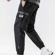 Bolsos laterais dos homens carga harem calças 2021 fitas hip hop casual masculino joggers calças moda confortável streetwear calças 2024 - compre barato