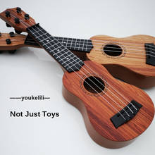 Guitarra pequeña para niños, juguete de simulación para principiantes, instrumento musical de Piano con púa/40 2024 - compra barato