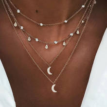 Ожерелье женское Многоуровневое золотистое, с подвеской в виде звезды, Луны, солнца 2024 - купить недорого