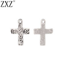 ZXZ-abalorios de plata tibetana para fabricación de joyas, 20 unidades, Cruz de amor, colgante de crisol, abalorios para joyería DIY, 21x15mm 2024 - compra barato
