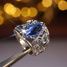 Роскошное женское кольцо с синим кристаллом, винтажные большие свадебные кольца серебряного цвета для женщин, модное обручальное кольцо с полым цветком из циркония 2024 - купить недорого