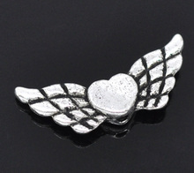 DoreenBeads Zinc metal alloy Spacer Beads Wing silver color About 22mm(7/8")x 9mm(3/8"),Hole:Approx 1mm,10 PCs 2024 - buy cheap