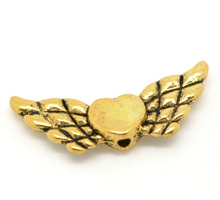 Doreenbeads 50 tons de ouro asas de coração contas amuletos 22x9mm (azul), em yiwu da china 2024 - compre barato