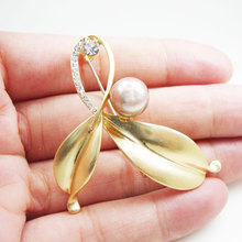 Perla de tono dorado lazo-Nudo flor broche Pin Rhinestone cristal accesorios de mujer 2024 - compra barato