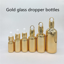 Botella de vidrio de oro de 50ml con botella de aceite esencial cuentagotas, botellas de Perfume de 200 piezas 2024 - compra barato