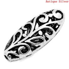 DoreenBeads Spacer Beads Oval Silver Color Hollow Flower Carved 23x10mm,Hole:Approx 1.5mm,20PCs (B23155), yiwu 2024 - buy cheap