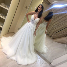 Vestidos de novia con ilusión encantadora, cuello en V, tirantes finos, apliques, línea A, longitud hasta el suelo, color blanco marfil 2024 - compra barato