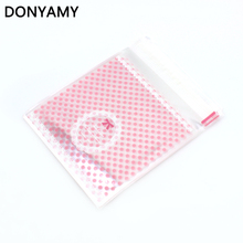 50 pcs/lot 11X10cm Cookie packaging pink dot bowknot self-adhesive plastic bags for biscuits snack baking package 2024 - buy cheap