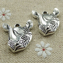 105 piezas de abalorios de rinoceronte de plata tibetana 23x20mm #438 2024 - compra barato