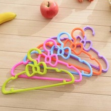 27*14cm Baby bowknot hanger child clothes pegs plastic kids clothes hangers for clothes drying rack cloth hanger storage 1Piece 2024 - buy cheap