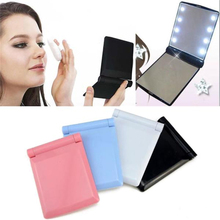 Espejo de maquillaje portátil para mujer, 8 luces LED, 7 colores, ABS, cosmética, plegable, compacto, con batería, 1 unidad 2024 - compra barato