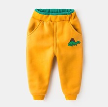 Новинка 2019, кашемировые штаны для упражнений для мальчиков и девочек, утепленные хлопковые зимние детские брюки с динозавром, детские шаровары, теплая детская одежда 2024 - купить недорого