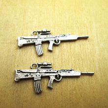 10 pcs 45x17mm Machine Gun Encantos 2 face Submachine gun Encantos pingente DIY colar/pulseiras encantos tom de prata antigo 2024 - compre barato