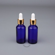 Gotero de aceite esencial, botella de vidrio azul vacío de 30ml, 1OZ, tapa dorada viales ables, caja de viaje portátil, 10 unids/lote 2024 - compra barato
