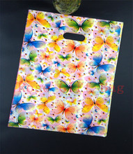 Wholesale 50pcs/lot Butterflies Design Plastic Bag 25x35cm Shopping Jewelry Boutique Packaging Bag Plastic Gift Bags With Handle 2024 - buy cheap