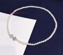 Nueva moda simple perla de agua dulce natural 6-7 MM cerca redondo 6-7 MM reflejo collar de perlas incrustaciones zircon corazón broche 2024 - compra barato