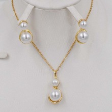 Conjunto de pendientes y collar de perlas de imitación para mujer, de color dorado, a la moda, cristal transparente, elegante, fiesta, regalo, joyería de boda 2024 - compra barato