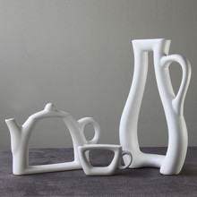 Simples elegante Abstrato Criativo Cerâmica Branca Vaso Decorativo Em Forma de Bule de chá Xícara de Porcelana Arte e Artesanato Ornamento Acessórios 2024 - compre barato