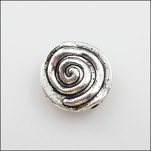 Cuentas espaciadoras planas redondas giratorias en espiral de Color plata tibetana, abalorios de 12mm, 25 uds. 2024 - compra barato