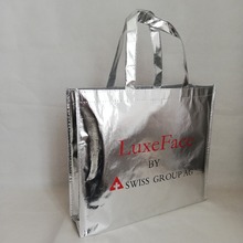 Bolsas de mano para compras al por mayor, 500 unids/lote, láser metálico plateado brillante, elegante, no tejido, personalizado, para Feria, exposición 2024 - compra barato