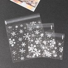 Paquete de bolsas de galletas transparentes para hornear, bolsas de caramelos autoadhesivas de copos de nieve de Navidad, pequeñas bolsas de plástico, bolsa de regalo, 100 unidades 2024 - compra barato