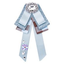 De moda de hipérbole de Lazo de cinta Bowknot broches de cristal de tela pines para las mujeres 2024 - compra barato
