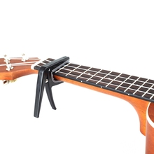 Cejilla de ukelele, abrazadera de plástico de cambio rápido para guitarra eléctrica acústica de una sola mano, accesorio de 4 cuerdas 2024 - compra barato