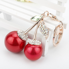 Dongsheng-Llavero Cadena de mano con diamantes de imitación para mujer, llavero con diseño de hojas doradas y cerezas rojas y cristales 2024 - compra barato