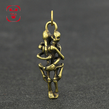 Vintage Brass Mini Cute Hug Skull Statue Keychain Pendant Decoration Ornament Sculpture Home Office Desk Ornament Funny Toy Gift 2024 - buy cheap