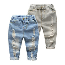 Джинсы с дырками для мальчиков и девочек, новые повседневные штаны из хлопка отличного качества для малышей, удобная детская одежда 2024 - купить недорого