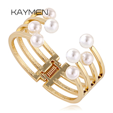 KAYMEN-pulsera de perlas doradas para mujer, brazalete de simetría con diseño único de 8 perlas de imitación, joyería de fiesta 2024 - compra barato