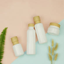 Botella de vidrio blanca con bomba, envase de cosméticos vacío de alta calidad, con tapa de grano de madera, para loción, champú, frascos de crema facial 2024 - compra barato