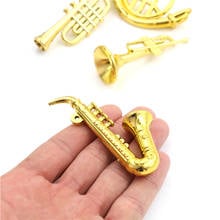 Instrumento Musical de plástico, accesorios de escena, Mini trompeta creativa portátil, Saxofón 1:12, miniatura de casa de muñecas, 1 ud. 2024 - compra barato