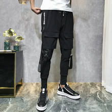 Pantalones pitillo con múltiples bolsillos para hombre, pantalón de chándal de estilo Hip Hop, con diseño rasgado, informal, a la moda, de longitud completa 2024 - compra barato