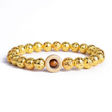 Pulsera de piedra de Lava de color dorado para mujer, brazalete con amuleto de Júpiter, distancia de ojo de Tigre, a la moda 2024 - compra barato