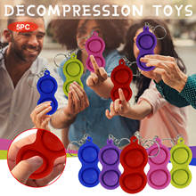 Llaveros sencillos con diseño de hoyuelos para niños y adultos, juguetes educativos para aliviar el estrés, de Color sólido, 1-5 Uds. 2024 - compra barato
