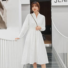 YIGELILA-vestido blanco a la moda para otoño, prenda informal de manga larga y cuello redondo, liso, acampanado, con botones, a media pantorrilla, 65392 2024 - compra barato