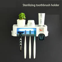 Soporte de cepillo de dientes inteligente para desinfección, exprimidor de pasta de dientes multifuncional montado en la pared, para Baño 2024 - compra barato